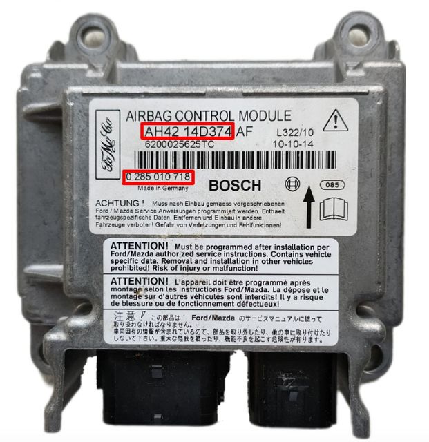 Example airbag control module label. The part number is on the sticker, boxed in red, such as 14D374 or 0 285 010 718.