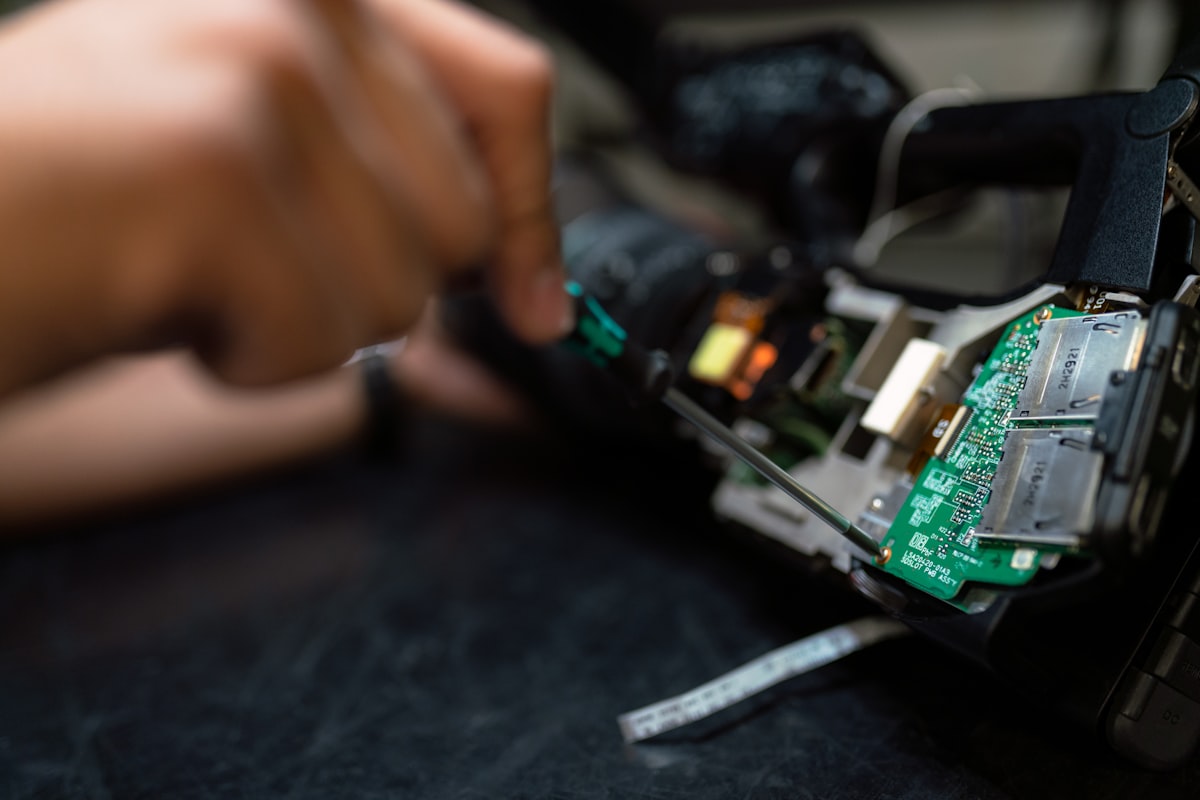 Technician inspecting electronic module components